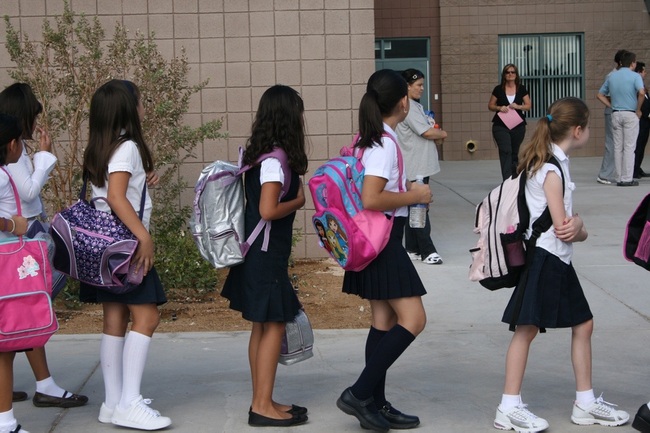 Students line up outside for the Ruben P. Diaz Elementary School's dedication and ribbon-cutting ceremony. Students at this school follow a recommended dress code.