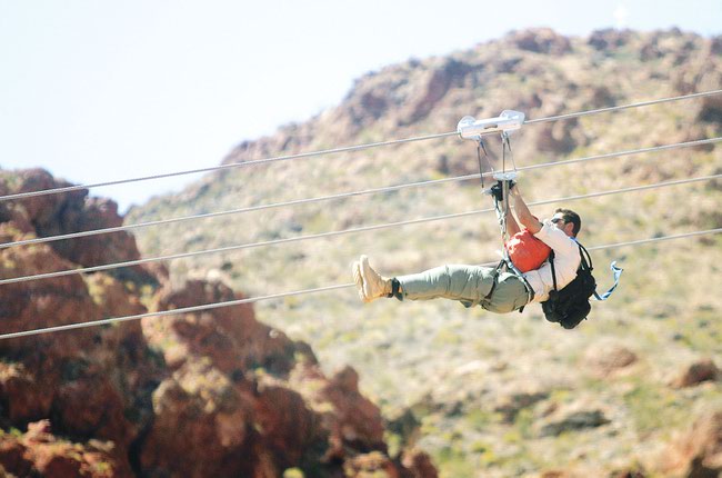 Bootleg Canyon flightline guide Max Margolis flies down Red Mountain, Thursday, Aug. 21, 2008.
