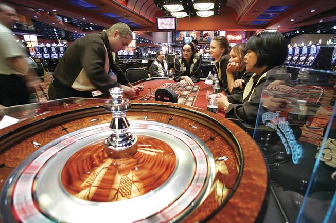 Roulette dealer John Furry, left, practices Tuesday at the Eastside Cannery for the $250 million, 307-room casino's opening tonight on Boulder Highway.