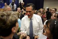 Mitt Romney visits with voters after he speaking to a crowded room of supporters at the Henderson Convention Center on Wednesday, Aug. 27, 2008.