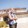 Silverado resident Katherine Kahlenberg stands outside the house she rents in Silverado that's currently in default by the owner.