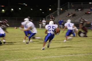 Junior running back Stephen Nixon carries the ball during Friday's loss to Dixie High School. 