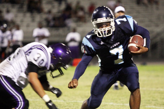Centennial running back Brandon Wright, right, attempts to keep away from Durango linebacker Carlos Moreno during the season opener at Centennial High School.