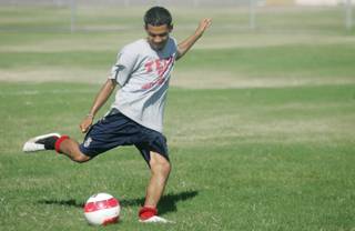 Juan Martinez aims for the goal during Southeast Career and Technical Center soccer practice on Aug. 26. Like many players on his team, Martinez has to make a long trip from North Las Vegas to participate in soccer practice.