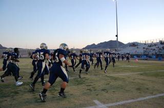 The Foothill High School Falcons enter the field, ready to battle the Cimarron-Memorial High School Spartans on Friday night. 