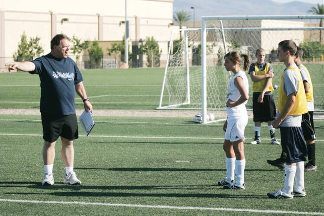 In this 2008 file photo, Lake Mead Christian Academy boy's soccer coach Bill Wadley talks to his team while practicing at McCarran Marketplace Park.
