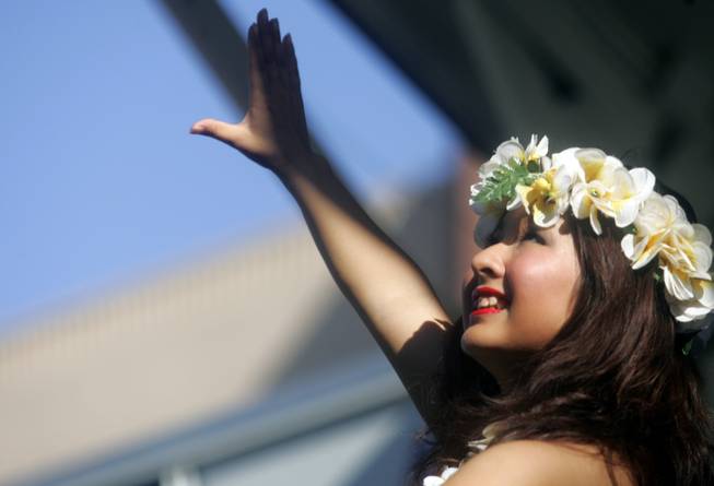 Akira Nonaka dances the hula during the 18th annual Prince Jonah Kuhio Ho'olaule'a Pacific Islands Festival at the Henderson Events Plaza. Nonaka is a member of the Hula Huio Hihao dance group.