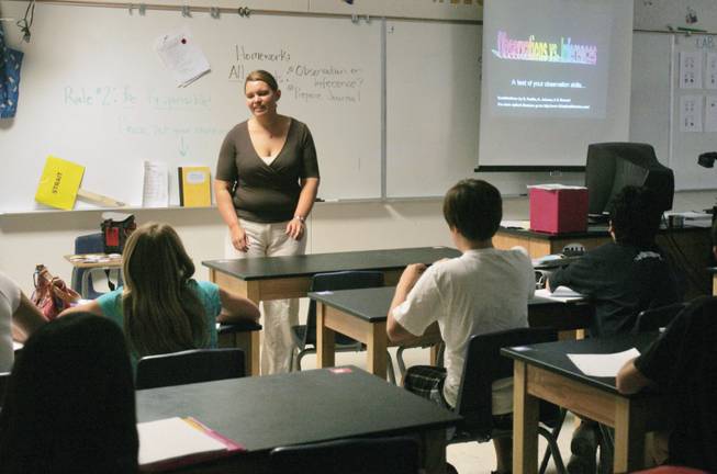 Science teacher Erin Strait gives a lecture on observations vs. inferences to a class full of seventh graders at Bob Miller Middle School on Sept. 11.