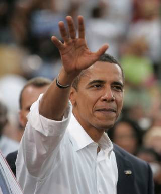 Barack Obama waves to supporters Wednesday, Sept. 17, 2008, at Cashman Field in Las Vegas.	