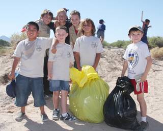 Members of Silverado's Cub Scout Pack 321 take a break from picking up trash at Sunset Park. Scouts from all over the Valley came to Sunset Park on Saturday to clean up garbage.