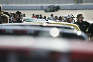 Trucks and crews wait their turn to qualify for the Qwik Liner Las Vegas 350 NASCAR Craftsman Truck Series at the Las Vegas Nevada Motor Speedway on Saturday.