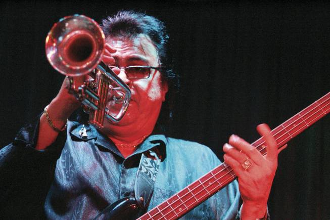 Rico Madrid plays trumpet and bass -- sometimes simultaneously -- and sings for SRO. The band's founder, who's also a booking agent, says he learned jazz from the legendary Mary Kaye.