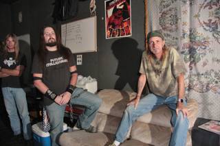Former Quiet Riot bassist and co-founder Kelly Garni, right, and friends John Lane, center, and Terry Span take a break from band practice.
