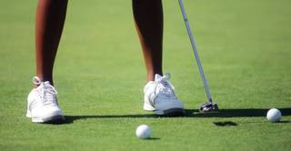 Bishop Gorman junior Nichole Corpus-Massucci practices putting at Siena Golf Club on driving range on Sept. 10.