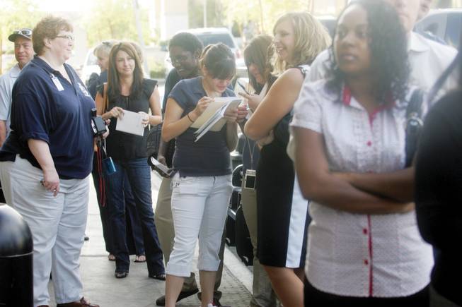 Community members wait in line at Starbucks to get a chance to discuss concerns or get advice for their starting businesses from Mayor Oscar Goodman on Sept. 19.  
