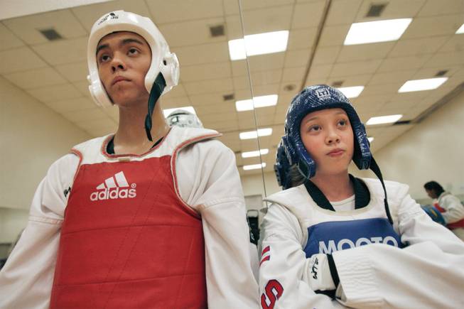 Kymberly Buset, 14, of Henderson and Devin Neudeck, 16, of Las Vegas, recently secured spots on the Jr National Team at the Amateur Athletic Union Taekwondo Team finals in Florida.