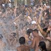 The pool turns to whitewater as the crowd erupts to live house music spun by famous DJs on a Rehab Sunday.
