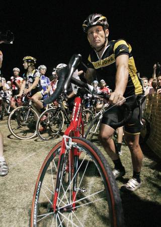 Cancer survivor and seven-time Tour de France winner Lance Armstrong waits for the start of the 2008 Cross Vegas race Wednesday at Desert Breeze Park.