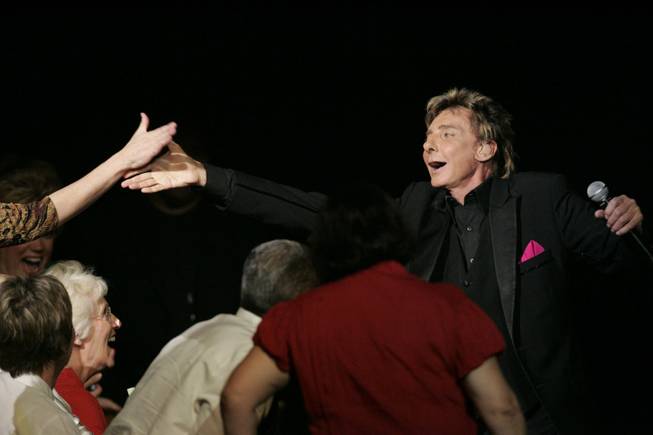 Barry Manilow's show at the Hilton has undergone a makeover and been renamed "Ultimate Manilow: The Hits," but fan interaction and a focus on hits remain.