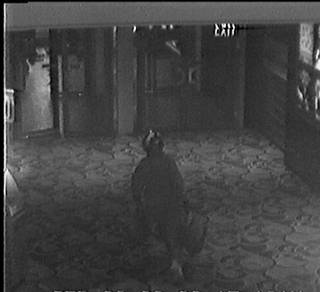 A photo from a surveillance video shows a suspect wearing a motorcycle helmet fleeing after robbing the Las Vegas Hilton sports book Friday, Sept. 26, 2008.