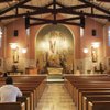 St. Joan of Arc Church, built in 1939 to replace the original chapel, can accommodate 400. While 400 families are registered with the parish, Mass attendance swells with tourists from nearby casinos.