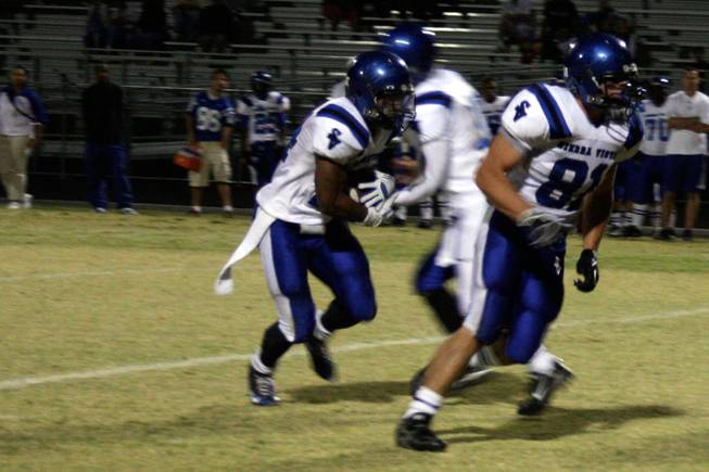 Sierra Vista senior Akil Sharp runs with the ball during Friday's game against Spring Valley.