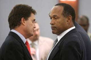 O.J. Simpson, right, with his lawyer Yale Galanter wait for a verdict of guilty on all counts to be read following his trial at the Clark County Regional Justice Center in Las Vegas on Friday, Oct. 3, 2008. The verdict comes 13 years to the day after Simpson was acquitted of murdering his ex-wife Nicole Brown Simpson and Ron Goldman.