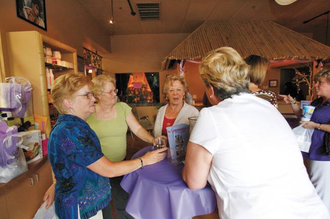 From left, Ellen Marasia, Judy Gereneser, Gene Woodenberg and Sue Clark mingle during the Girls Night Out fundraiser held at the Destination Island Spa and Salon last Thursday.
