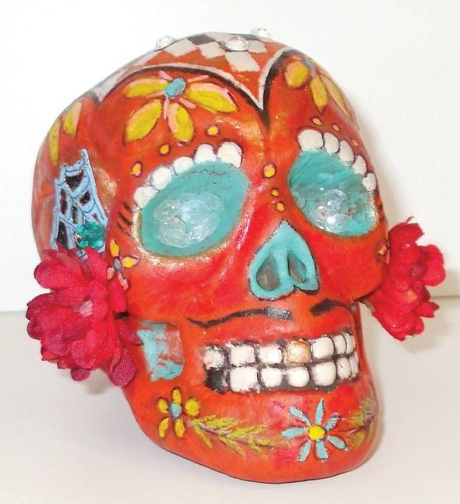 Mexican Sugar Skulls, decorated with sugar, frosting, sequins and foil are used to honor deceased loved ones.