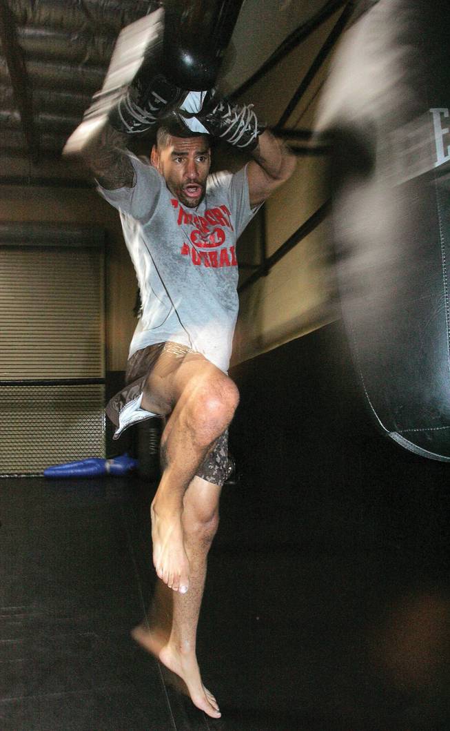 Training for an upcoming fight, mixed martial artist Jay Hieron jumps into a kick at X-Treme Couture Gym on Oct. 3. Hieron will be competing in Night of Combat 2 at the Thomas and Mack Center.  