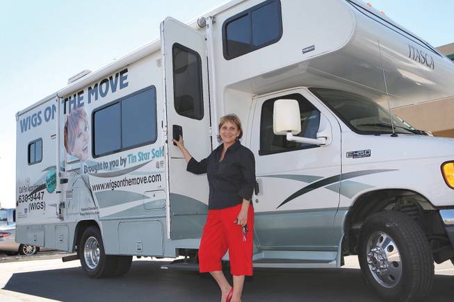 Owner Jane Nelson opens the doors to her mobile salon, "Wigs on the Move," in order to provide services to clientele whose health will not permit them to visit a conventional hair salon. She has been styling hair since 1970.