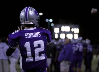 Silverado's Kyle Simmons warms up on the sideline before Friday's game against Foothill.