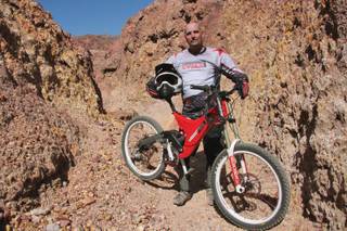 Craig Van Cleve, 47, one of the top mountain bikers in Henderson, poses in the Love Canal at the famous mountain bike track Bootleg Canyon in Boulder City. Van Cleve won the National Championship Series for his performance last month in downhill mountain bike racing for his age class.