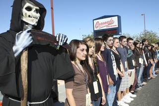 During the Every 15 Minutes program at Coronado High School, the Grim Reaper and students of the 