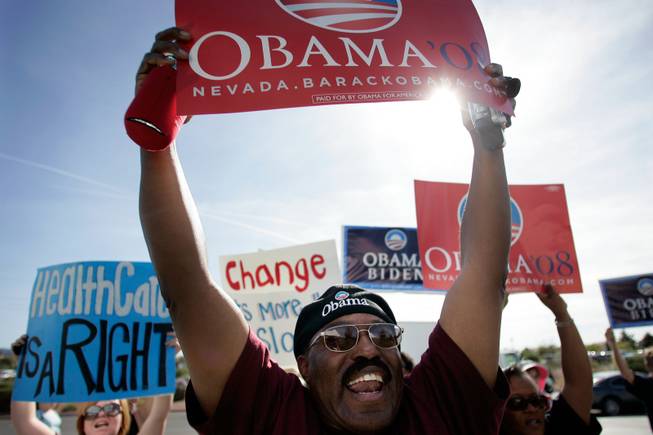 Barack Obama supporter Dennis Gray of Henderson demonstrates with other Democrats outside the Sarah Palin rally at the Henderson Pavilion in Henderson Tuesday.