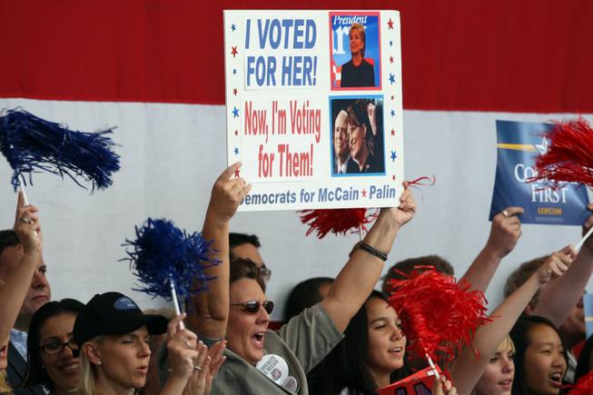 A supporter holds up his sign as Republican vice presidential nominee Alaska Governor Sarah Palin speaks during a rally in Henderson, Nev., Oct. 21, 2008. 