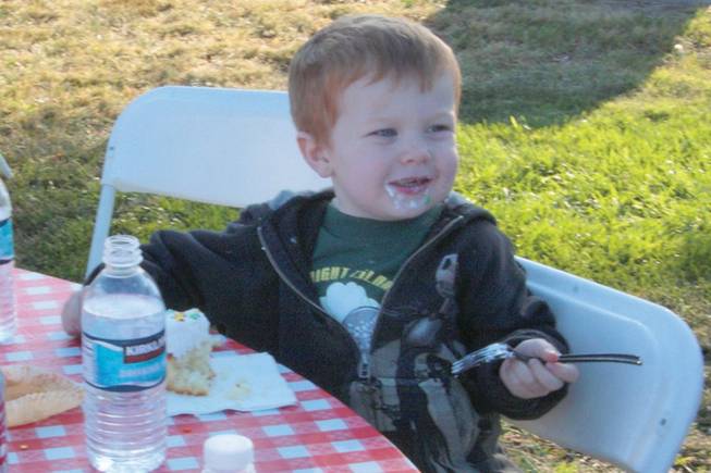 Spencer Walsh, 3, enjoys a cupcake at Green Valley Baptist Church and New Community Church's annual steak fry and picnic at Silver Springs Park.