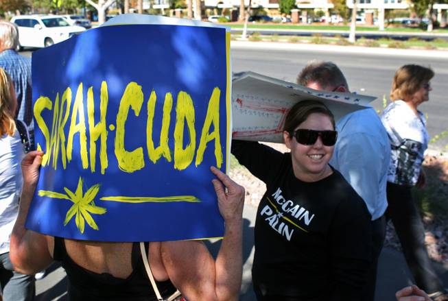 Chris Rimmer, left, of Henderson, and Kaiulani Tanaka-Sanders of Las Vegas wait in line to get into the Henderson Pavilion where Republican vice presidential candidate Sarah Palin will be speaking today, October 21, 2008. 