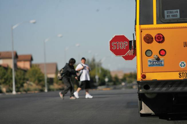 Faiss Middle School students exit their school bus on Thursday.