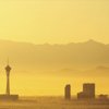 The sun rises behind the Stratosphere, left, and some Strip properties. The Stratosphere was recently sold to investment giant Goldman Sachs, which went back on its stated intent to keep management intact.
