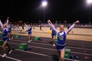 Green Valley cheerleaders keep up the pep during Friday's game. Green Valley defeated Silverado 31-13.