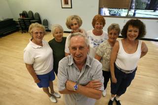 Dance instructor Jim Kvool, foreground, poses with, from right, Mary-Lou Wood, Joann Marty, Rickie Green, Pat Schmidt, Gillian Romesburg and Fran Hart at the Sun City MacDonald Ranch recreation center Oct. 22.