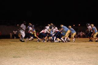 The Coronado defense stops the Foothill Falcons during the first quarter Thursday night. 