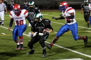 Rancho's Zach Foulkrod (1) tries to dodge Valley players during Thursday's game at Rancho.