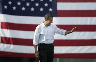Democratic presidential candidate Barack Obama waves as he takes the stage while making a campaign appearance at Coronado High School Saturday, Nov. 1, 2008. 