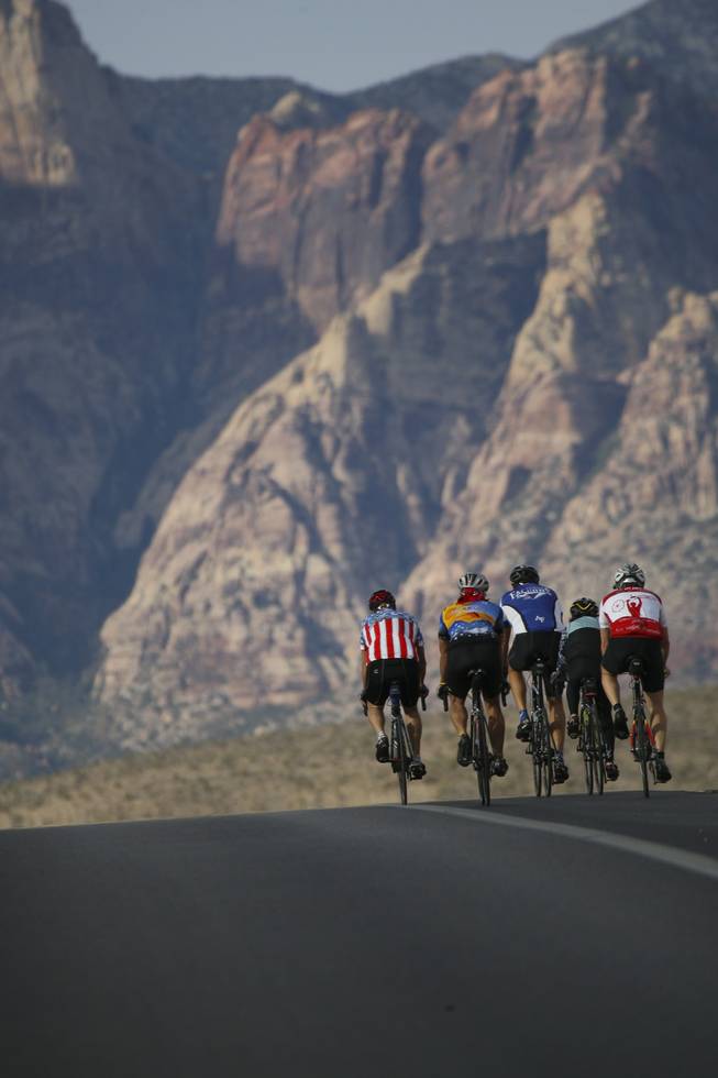 Climbing the challenging foothills of Red Rock Canyon, cyclists of the Las Vegas Valley Bike Club crest the top of the hill while heading toward Blue Diamond on their 50-mile morning ride Saturday.