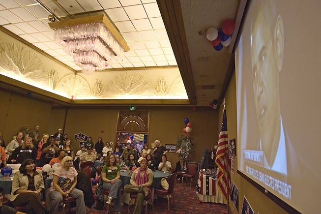 A group of Democratic supporters watches the acceptance speech delivered by President-elect Barack Obama on Tuesday night in a Red Lion hotel ballroom. Reaction to the Illinois senator's historic win ranged in Elko among happiness, anger, disbelief and resignation. 