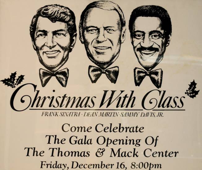 A poster for a "Christmas with Class" concert starring Frank Sinatra, Dean Martin, Sammy Davis Jr. hangs in the halls of the Thomas & Mack Center.