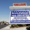 This sign in the northwest Las Vegas Valley is one indication Nevada's foreclosure rate leads the nation. A UNLV economist says the Las Vegas economy could be weak through 2010. 