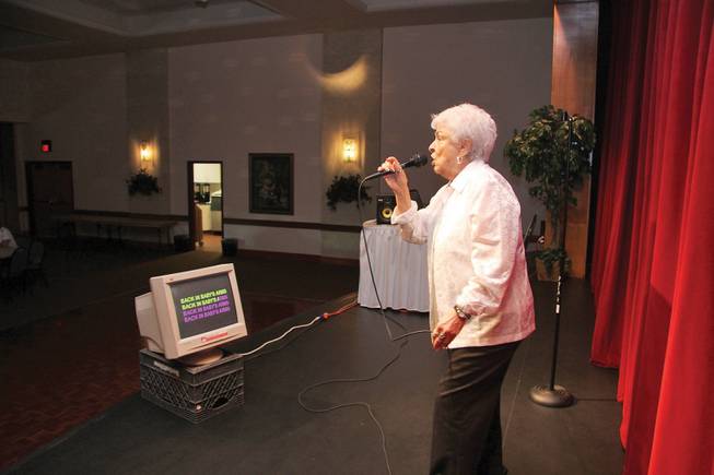 Marie Edens sings Patsy Cline's "Back In Baby's Arms" during karaoke night at Sun City MacDonald Ranch.